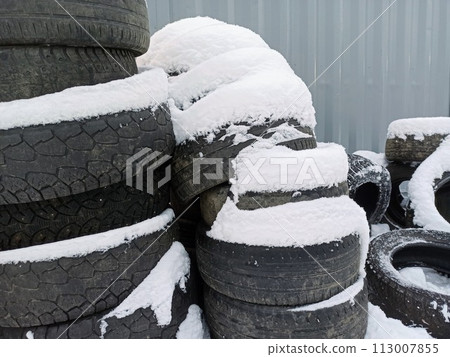 Tires covered with snow at a tire store, closeup of photo	 113007855