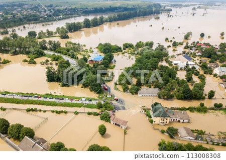 Aerial view of flooded houses with dirty water of Dnister river in Halych town, western Ukraine. Aerial view of flooded houses with dirty water of Dnister river in Halych town, western Ukraine. 113008308