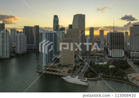 Evening urban landscape of downtown district of Miami Brickell in Florida, USA. Skyline with dark high skyscraper buildings in modern american megapolis Evening urban landscape of downtown district of Miami Brickell in Florida, USA. Skyline with dark high skyscraper buildings in modern american megapolis 113008410