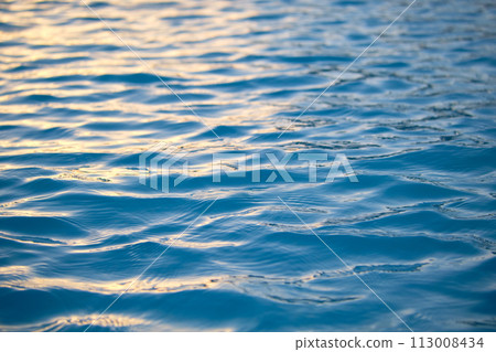 Closeup seascape surface of blue sea water with small ripple waves. 113008434