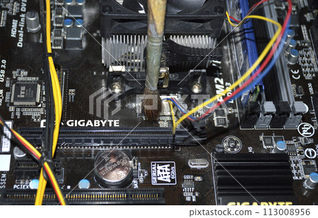 Cleaning the computer system unit with a dust brush. system unit maintenance Cleaning the computer system unit with a dust brush. system unit maintenance 113008956