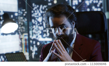 Powerful wealthy banker with vast corporate network rests in his rich tower office, deliberately forging solid legal track record. Worldwide leader earns huge amounts of income from stock trade. Powerful wealthy banker with vast corporate network rests in his rich tower office, deliberately forging solid legal track record. Worldwide leader earns huge amounts of income from stock trade. 113009846