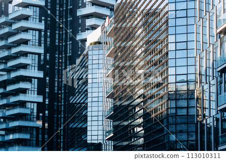 Skyscraper buildings, modern office buildings in commercial area. Abstract architecture Skyscraper buildings, modern office buildings in commercial area. Abstract architecture 113010311