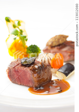 Main beef steak of the French course, fashionable presentation stock image Main beef steak of the French course, fashionable presentation stock image 113012080