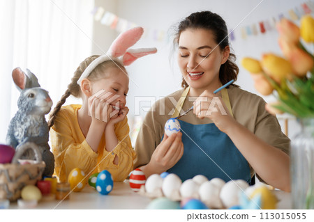 family preparing for Easter 113015055