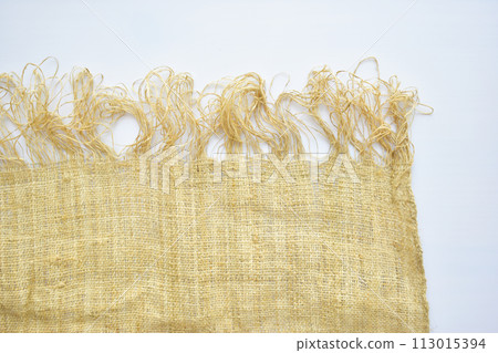 torn sackcloth isolated on white background, burlap fabric texture for design 113015394
