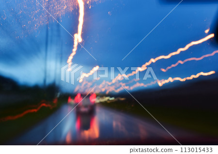 light of car on road in the night, blurred traffic jam background with rain light of car on road in the night, blurred traffic jam background with rain 113015433