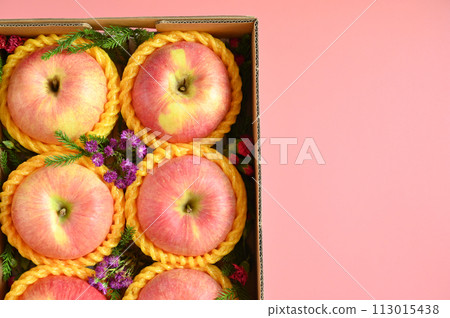 beautiful apple in the box on pink backgrond, healthy fruit beautiful apple in the box on pink backgrond, healthy fruit 113015438