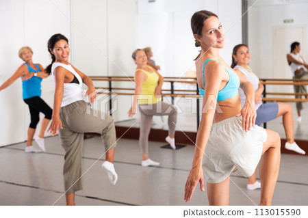 Portrait of an active young woman enjoying energetic dancing Portrait of an active young woman enjoying energetic dancing 113015590