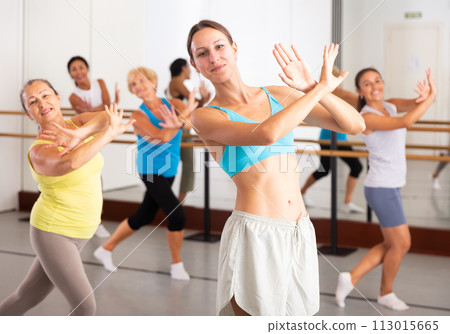 Young dancing woman practices energetic swing Young dancing woman practices energetic swing 113015665