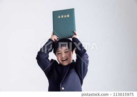 A smiling boy holding a graduation certificate 113015975