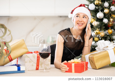 girl in New Year s atmosphere speaks on phone girl in New Year s atmosphere speaks on phone 113016007