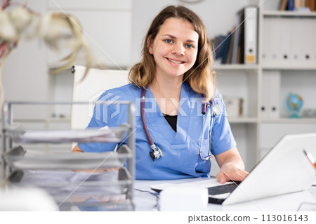 Portrait of female doctor in office 113016143