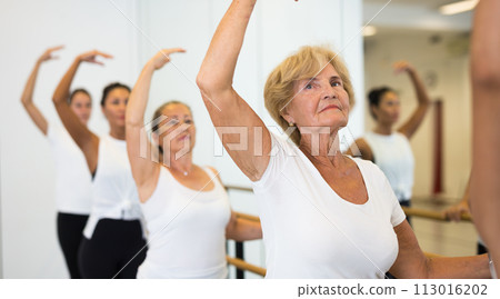 Group of women doing ballet dance moves 113016202