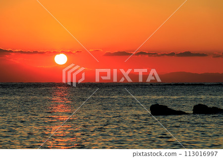 Beautiful sunset and silhouette of Mt. Fuji seen from the beach. At Araihama Beach, Miura City, Kanagawa Prefecture, Japan. 20 Beautiful sunset and silhouette of Mt. Fuji seen from the beach. At Araihama Beach, Miura City, Kanagawa Prefecture, Japan. 20 113016997