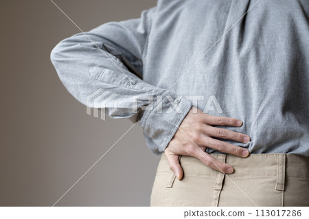 Man with back pain, body parts, faceless, back view 113017286