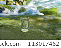Natural water poured into a glass 113017462