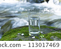 Natural water poured into a glass 113017469