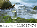 Natural water poured into a glass 113017474