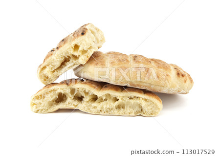 Toasted pita bread isolated on a white background Toasted pita bread isolated on a white background 113017529