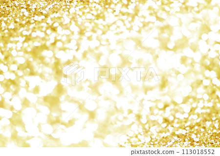 Gold bokeh texture. Festive glitter background with defocused lights Gold bokeh texture. Festive glitter background with defocused lights 113018552