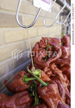 Detail of red vegetables in a market in Spain, healthy food, vegan 113019277