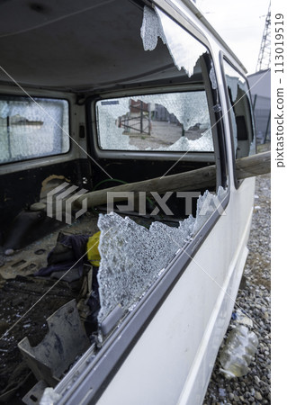 Detail of car destroyed by urban riots in the city 113019519