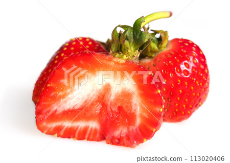Large cut strawberries on a white background. 113020406