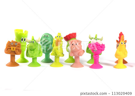 Bonstiki. A group of small rubber toys on a white background. Bonstiki. A group of small rubber toys on a white background. 113020409