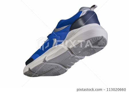Blue sneaker made of fabric with a white sole on a white background. Sport shoes. Blue sneaker made of fabric with a white sole on a white background. Sport shoes. 113020660