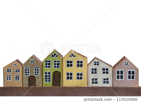 Wooden toy houses on a white background. Miniature town made of wood. 113020880