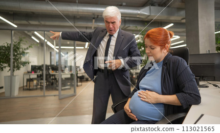 Elderly Caucasian man shouts at pregnant submissive woman and points to the door. Elderly Caucasian man shouts at pregnant submissive woman and points to the door. 113021565