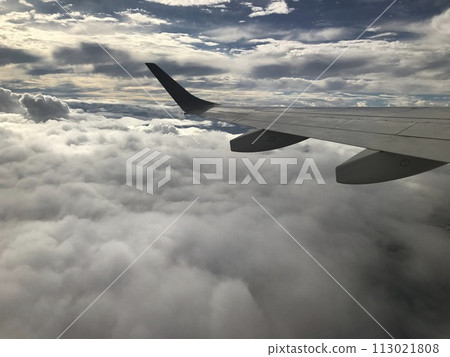 An airplane in the clouds An airplane in the clouds 113021808