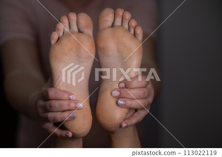 Close-up of a woman's feet massage. Close-up of a woman's feet massage. 113022119