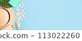 Banner for a summer vacation with shells, palm leaves and a straw hat. Blue background with copy space. Time relax. 113022260