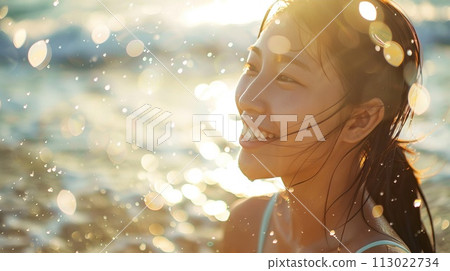 Joyful sunset glow - woman smiling by the sea 113022734