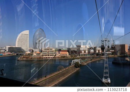 Views from riding in Yokohama Air Cabin showing Yokohama's Minatomirai area from above through the mirrored windows. In Yokohama Japan. 113023718