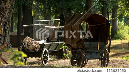 Historical Re-enactment. Russian Soviet World War Ii Peasant Carts In Forest. Wwii Equipment Of Red Army Historical Re-enactment. Russian Soviet World War Ii Peasant Carts In Forest. Wwii Equipment Of Red Army 113023960