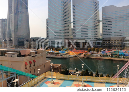 Views of Yokohama Minatomirai as seen from the Cosmo Clock 21 ferris wheel at the Cosmo World amusement park in minato mira 21 district of yokohama japan, originally the world's tallest ferris wheel. 113024153