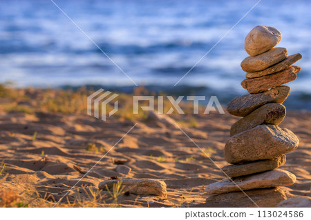 Stones balance on beach, sunrise shot 113024586