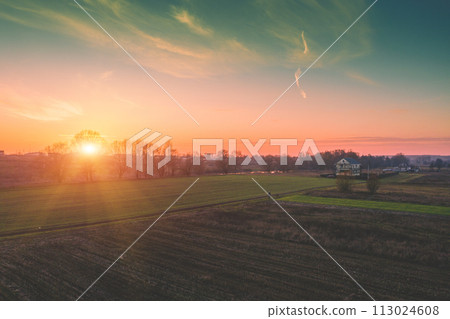 Colorful cloudy sky at sunset. Sunset over the countryside Colorful cloudy sky at sunset. Sunset over the countryside 113024608