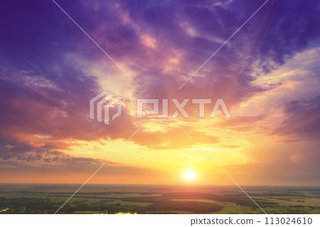 Colorful cloudy sky at sunset. Sunset over the countryside Colorful cloudy sky at sunset. Sunset over the countryside 113024610
