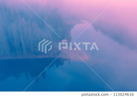 Early foggy morning. Sunrise on the lake. Aerial view. Minimalistic landscape. Gradient color. Lake Synevyr, Transcarpathia, Ukraine Early foggy morning. Sunrise on the lake. Aerial view. Minimalistic landscape. Gradient color. Lake Synevyr, Transcarpathia, Ukraine 113024616