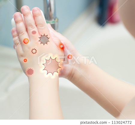 A child washes his hands with soap in the bathroom. The concept of hygiene and clean hands, infection, close-up, soundness 113024772