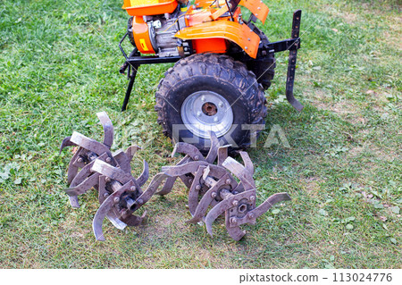 cutters complete with walk-behind tractor for work on the ground. Technique for agriculture. Motor cultivator 113024776