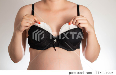 Bra pads against leakage of colostrum and milk in nursing mothers and pregnant women. Close-up 113024906