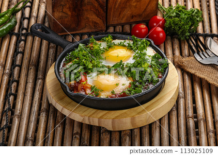 Shakshuka roasted egg in the pan with tomato 113025109