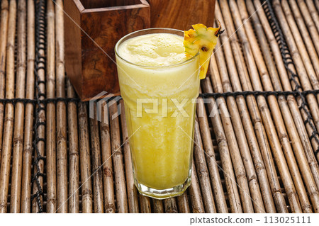 Sweet cold pineapple juice refreshment 113025111