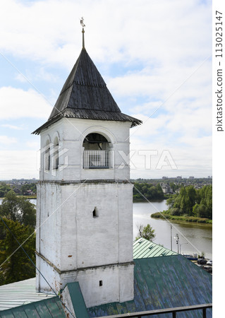 Medieval brick tower with wooden roof and weather vane in Yaroslavl, Russia 113025147