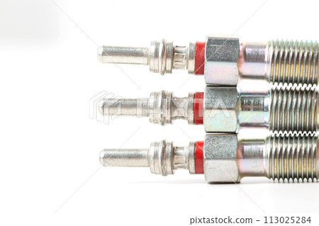 Modern ceramic glow plugs for warming up a diesel engine before starting. White background, isolate. Macro Modern ceramic glow plugs for warming up a diesel engine before starting. White background, isolate. Macro 113025284